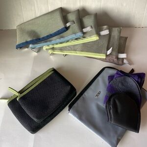 Tumi and assorted travel cosmetic makeup pouches